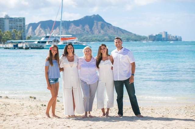 Five family members on the beach with Diamond Head in the background